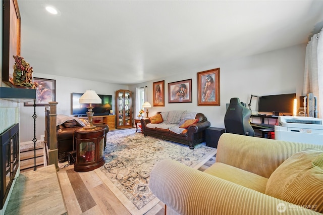513 SE Highland Park Dr, College Place, WA 99324 - living area with wood finished floors and a tile fireplace