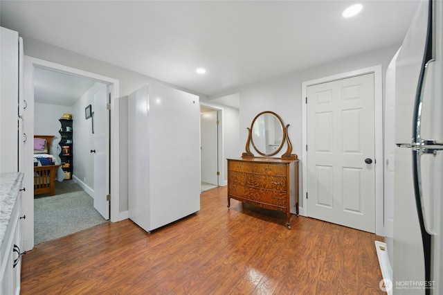 513 SE Highland Park Dr, College Place, WA 99324 - bedroom with freestanding refrigerator, wood finished floors, recessed lighting, and baseboards