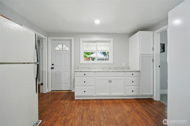 513 SE Highland Park Dr, College Place, WA 99324 - kitchen with freestanding refrigerator, dark wood-style floors, white cabinets, light stone counters, and recessed lighting