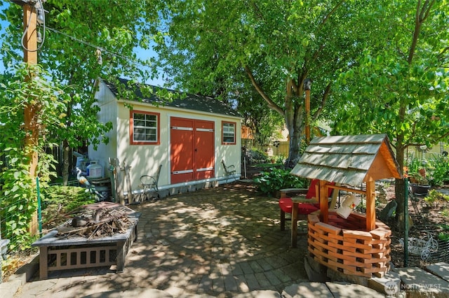 513 SE Highland Park Dr, College Place, WA 99324 - view of shed with an outdoor fire pit