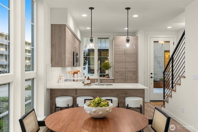 112F 2nd St S, Kirkland, WA 98033 - dining room featuring healthy amount of natural light, stairway, light wood-style flooring, and recessed lighting