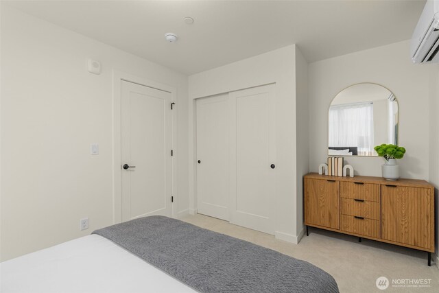 112F 2nd St S, Kirkland, WA 98033 - bedroom with a wall unit AC, a closet, and light carpet