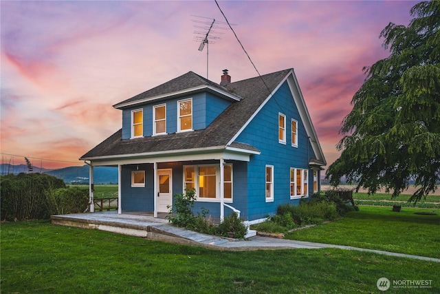 19719 Dry Slough Rd, Mount Vernon, WA 98273 - view of front of property with covered porch, a yard, a chimney, and roof with shingles