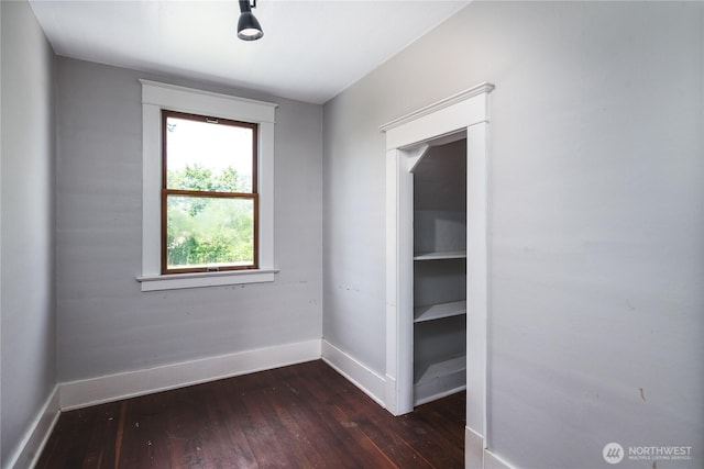 19719 Dry Slough Rd, Mount Vernon, WA 98273 - unfurnished room with baseboards and dark wood-style flooring