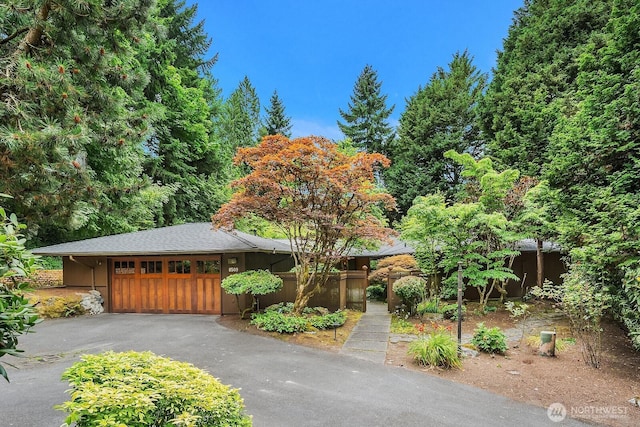 8509 NE 27th Pl, Clyde Hill, WA 98004 - view of front of house with asphalt driveway and a garage