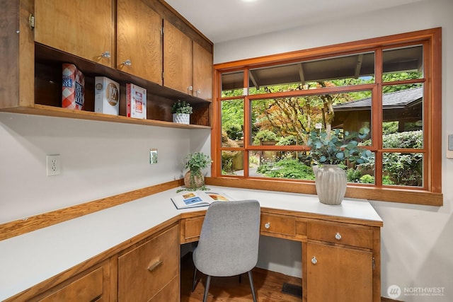 8509 NE 27th Pl, Clyde Hill, WA 98004 - office area featuring built in desk and wood finished floors
