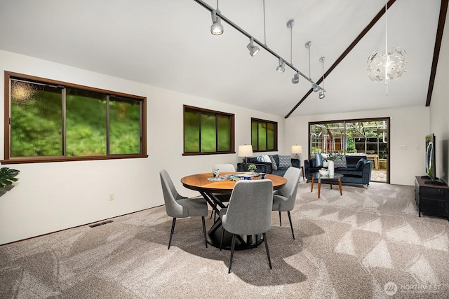8509 NE 27th Pl, Clyde Hill, WA 98004 - carpeted dining area featuring high vaulted ceiling