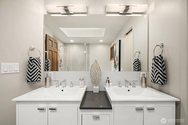 8509 NE 27th Pl, Clyde Hill, WA 98004 - full bathroom featuring double vanity, a shower stall, and tasteful backsplash