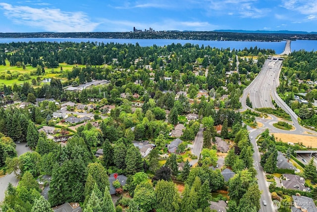 8509 NE 27th Pl, Clyde Hill, WA 98004 - aerial perspective of suburban area with a nearby body of water and a tree filled landscape