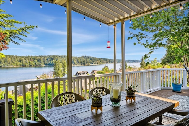 70 E Rustle Way, Grapeview, WA 98546 - wooden terrace featuring a water view, a forest view, and outdoor dining area