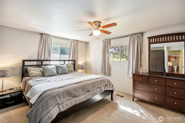 70 E Rustle Way, Grapeview, WA 98546 - carpeted bedroom featuring a ceiling fan