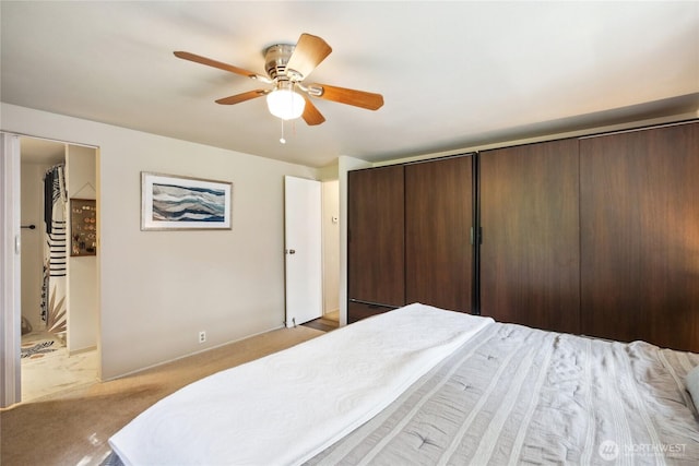 70 E Rustle Way, Grapeview, WA 98546 - bedroom with light carpet and a ceiling fan