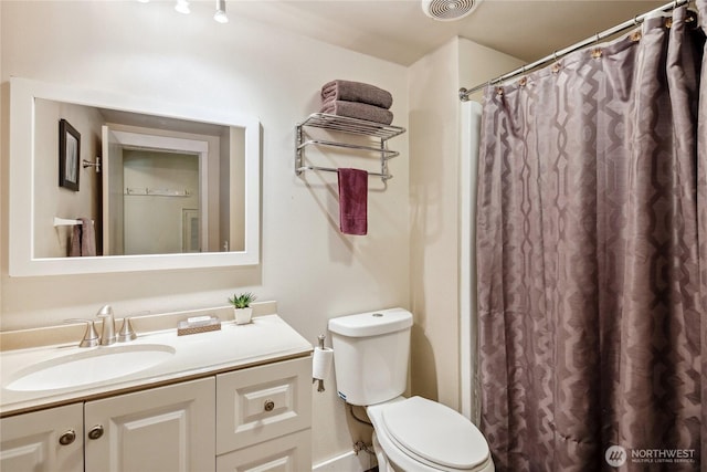 70 E Rustle Way, Grapeview, WA 98546 - bathroom with vanity, toilet, and curtained shower