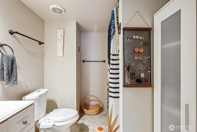70 E Rustle Way, Grapeview, WA 98546 - full bathroom with toilet, vanity, and curtained shower
