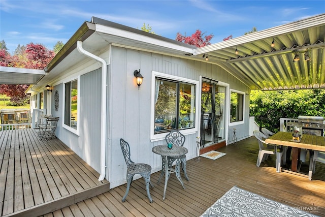 70 E Rustle Way, Grapeview, WA 98546 - wooden deck featuring outdoor dining area and a grill