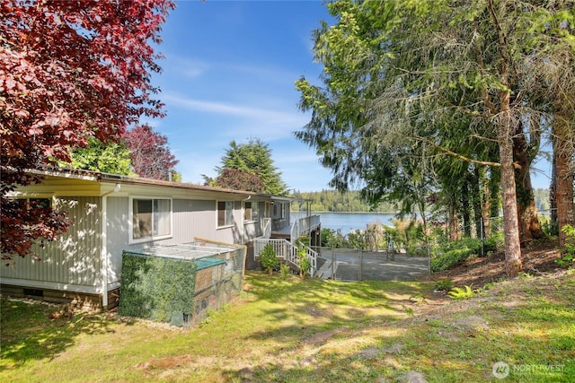 70 E Rustle Way, Grapeview, WA 98546 - view of grassy yard with stairway and a water view