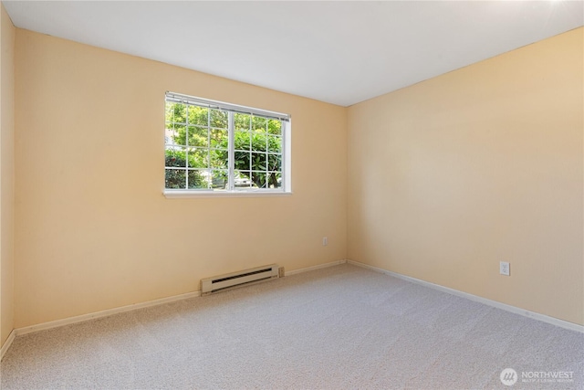 7453 Newcastle Golf Club Rd Unit B103, Newcastle, WA 98059 - carpeted spare room featuring a baseboard radiator and baseboards