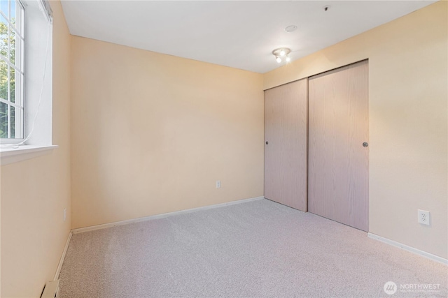 7453 Newcastle Golf Club Rd Unit B103, Newcastle, WA 98059 - unfurnished bedroom with carpet, a closet, and baseboards