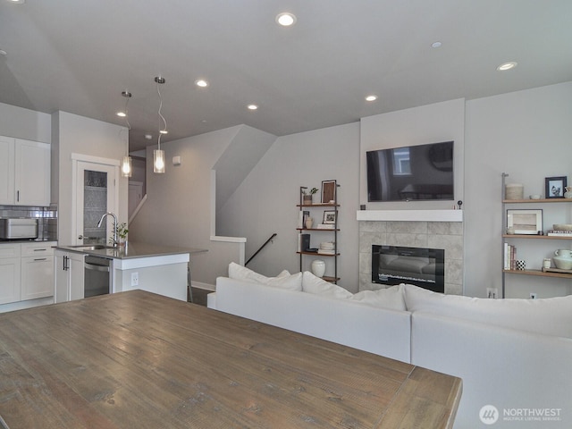 3230 148th St SW Unit C1, Lynnwood, WA 98087 - living room with recessed lighting and a tiled fireplace