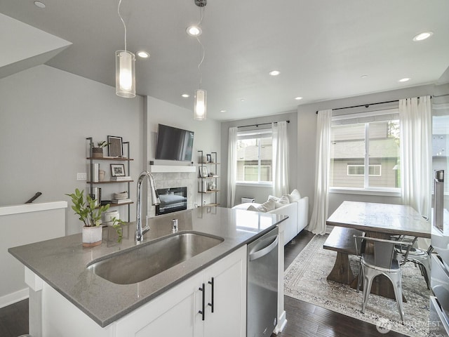 3230 148th St SW Unit C1, Lynnwood, WA 98087 - kitchen with a sink, dishwasher, stone countertops, an island with sink, and open floor plan