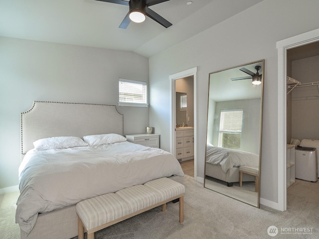 3230 148th St SW Unit C1, Lynnwood, WA 98087 - bedroom with light colored carpet, washer and dryer, baseboards, vaulted ceiling, and a spacious closet