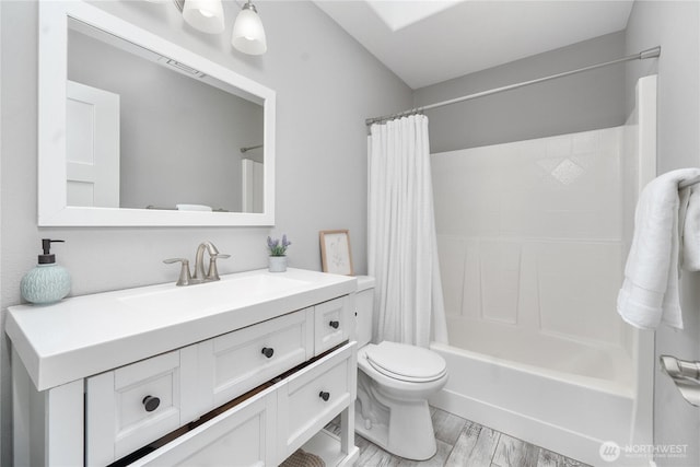 9906 328th St E, Graham, WA 98338 - bathroom with toilet, vanity, shower / bath combination with curtain, and wood finished floors