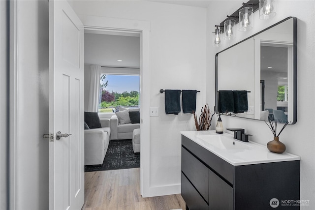 9906 328th St E, Graham, WA 98338 - bathroom featuring ensuite bathroom, vanity, wood finished floors, and baseboards