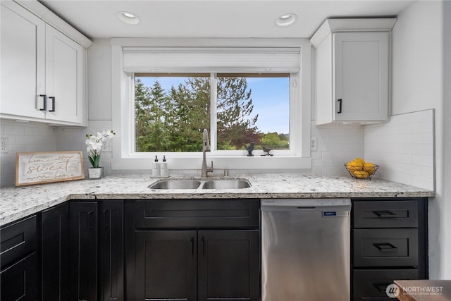 9906 328th St E, Graham, WA 98338 - kitchen with dishwasher, a sink, white cabinets, light stone counters, and backsplash
