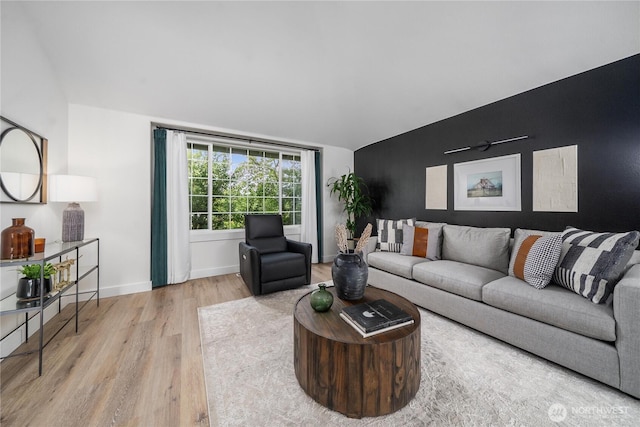 9906 328th St E, Graham, WA 98338 - living room featuring wood finished floors, vaulted ceiling, and baseboards