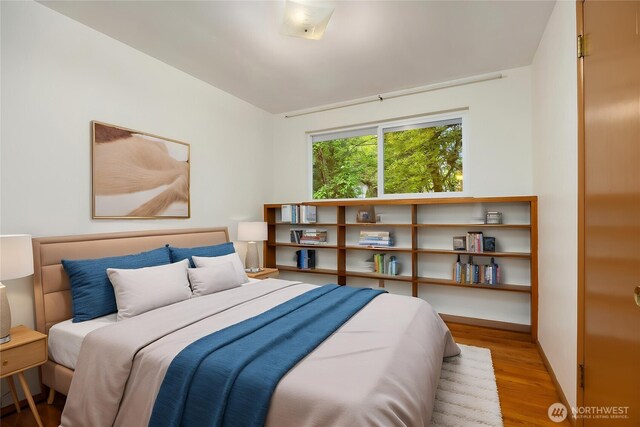 10210 NE 23rd St, Bellevue, WA 98004 - bedroom featuring wood finished floors and baseboards