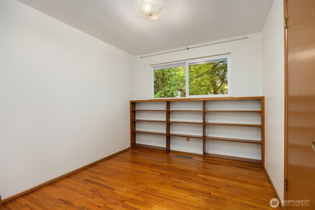 10210 NE 23rd St, Bellevue, WA 98004 - unfurnished room with wood finished floors and baseboards
