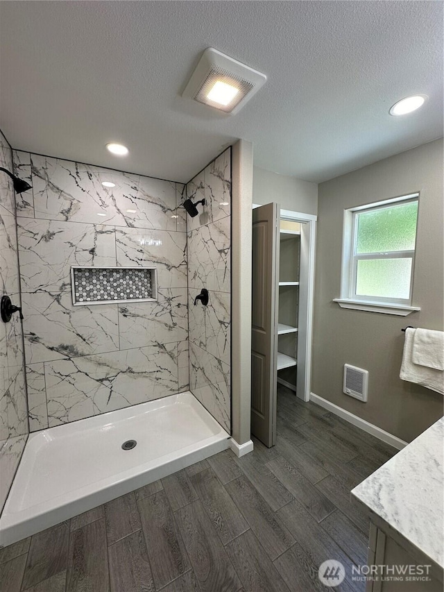 511 Baila Way, Aberdeen, WA 98520 - full bath with a marble finish shower, a textured ceiling, wood finished floors, vanity, and recessed lighting