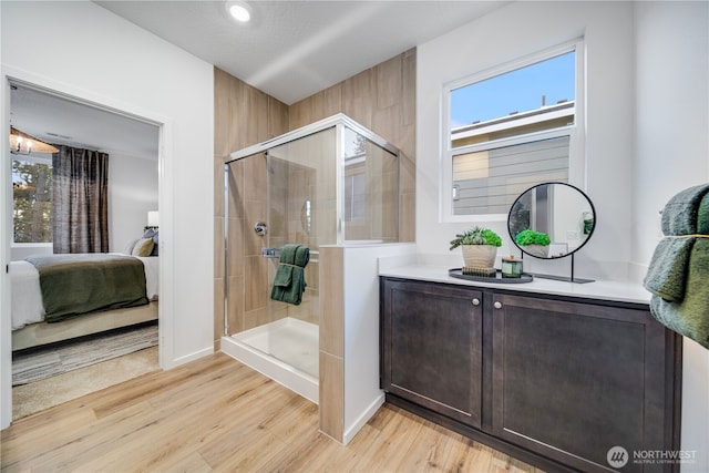 4204 SW Rustler St, Port Orchard, WA 98367 - ensuite bathroom with vanity, a shower stall, wood finished floors, baseboards, and recessed lighting