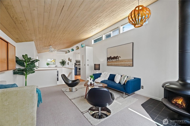 4618 3rd Ave NW, Seattle, WA 98107 - living area featuring a wood stove, wooden ceiling, carpet floors, and a ceiling fan
