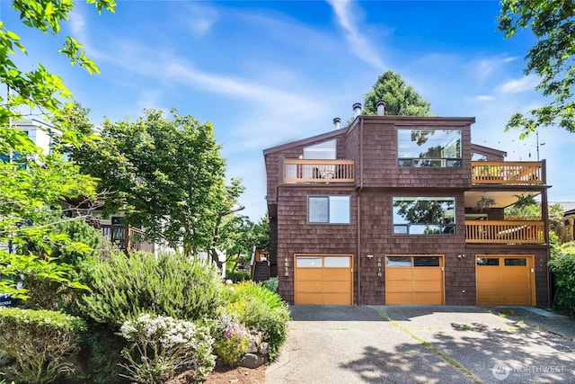 4618 3rd Ave NW, Seattle, WA 98107 - view of front of home with a balcony, a garage, and driveway