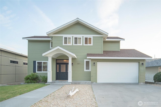 1071 S Section Pl, Quincy, WA 98848 - traditional home with concrete driveway, roof with shingles, and an attached garage