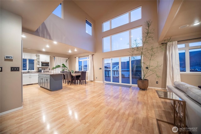 1071 S Section Pl, Quincy, WA 98848 - living room featuring light wood-style flooring and a towering ceiling