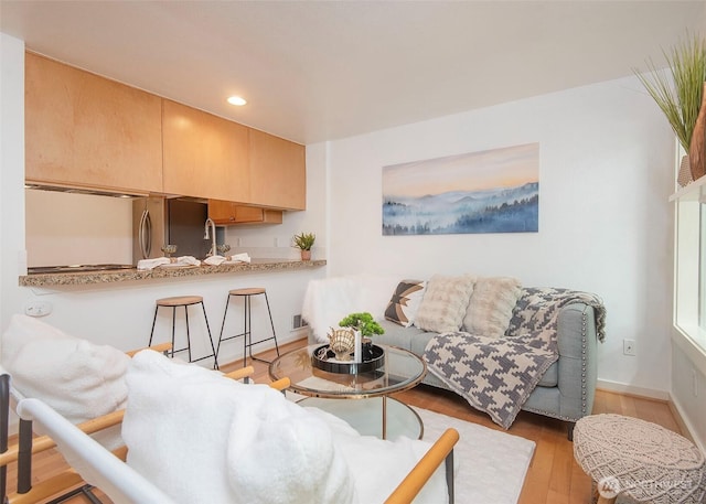 301 W Raye St Unit 105, Seattle, WA 98119 - living area featuring recessed lighting, light wood-type flooring, and baseboards