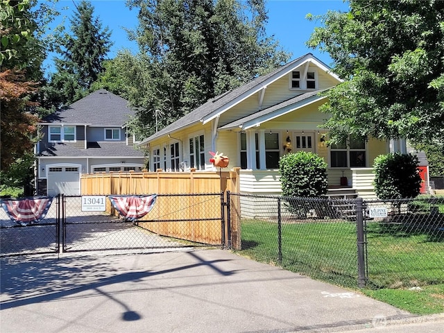 13039 56th Ave, Tukwila, WA 98178 - view of front of house with asphalt driveway, a shingled roof, and an attached garage