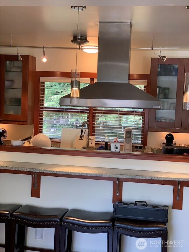13039 56th Ave, Tukwila, WA 98178 - kitchen with island exhaust hood, glass insert cabinets, and a sink