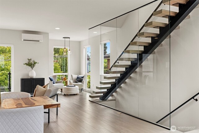 2014 E Pine St Unit A, Seattle, WA 98122 - stairway with a wall mounted AC, recessed lighting, and wood finished floors