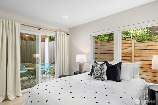 2014 E Pine St Unit A, Seattle, WA 98122 - bedroom featuring access to outside, wood finished floors, and recessed lighting