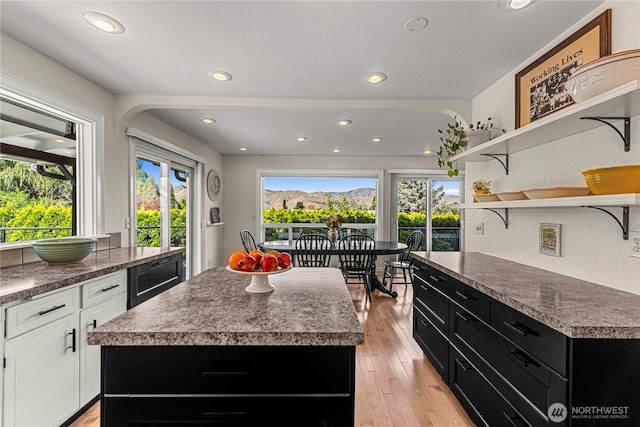 1108 Dale St SE, East Wenatchee, WA 98802 - kitchen featuring open shelves, dark cabinets, white cabinetry, recessed lighting, and light wood-style flooring