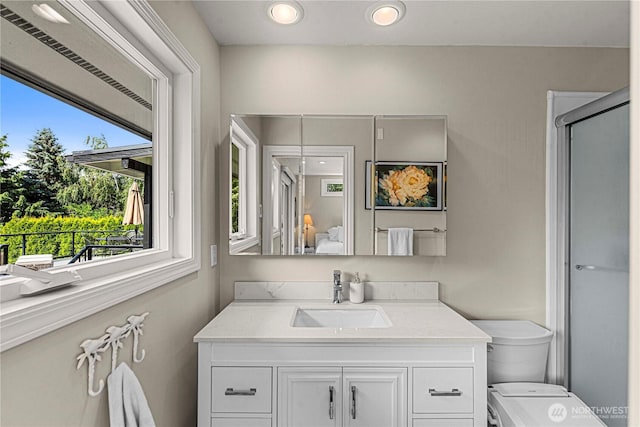 1108 Dale St SE, East Wenatchee, WA 98802 - bathroom featuring vanity, a shower with door, and recessed lighting