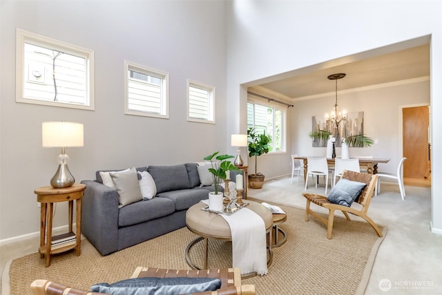 1913 NE 32nd St, Renton, WA 98056 - carpeted living area with a chandelier, baseboards, and ornamental molding