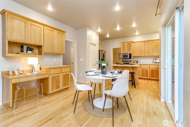 1913 NE 32nd St, Renton, WA 98056 - kitchen featuring stainless steel appliances, light brown cabinets, light wood-style floors, light countertops, and recessed lighting