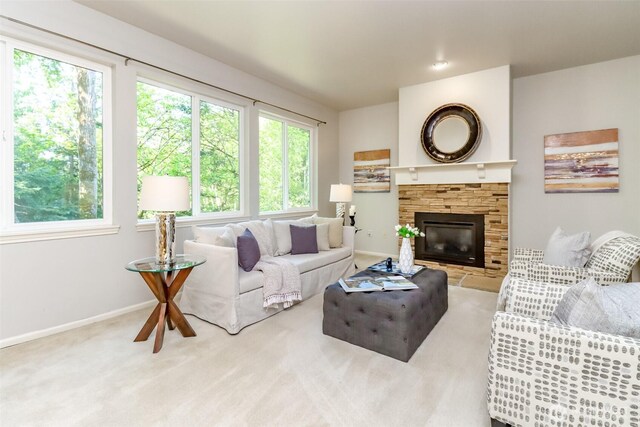 1913 NE 32nd St, Renton, WA 98056 - living area featuring baseboards, a fireplace, and carpet flooring
