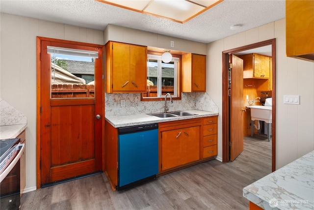 16327 Smokey Point Blvd Unit 1 & 2, Marysville, WA 98271 - kitchen with dishwasher, a sink, light wood-style floors, stainless steel range with electric stovetop, and light countertops