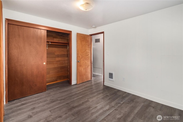 16327 Smokey Point Blvd Unit 1 & 2, Marysville, WA 98271 - unfurnished bedroom with wood finished floors, baseboards, heating unit, and a closet