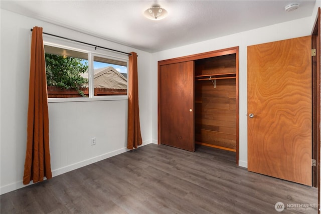 16327 Smokey Point Blvd Unit 1 & 2, Marysville, WA 98271 - unfurnished bedroom featuring wood finished floors, a closet, and baseboards